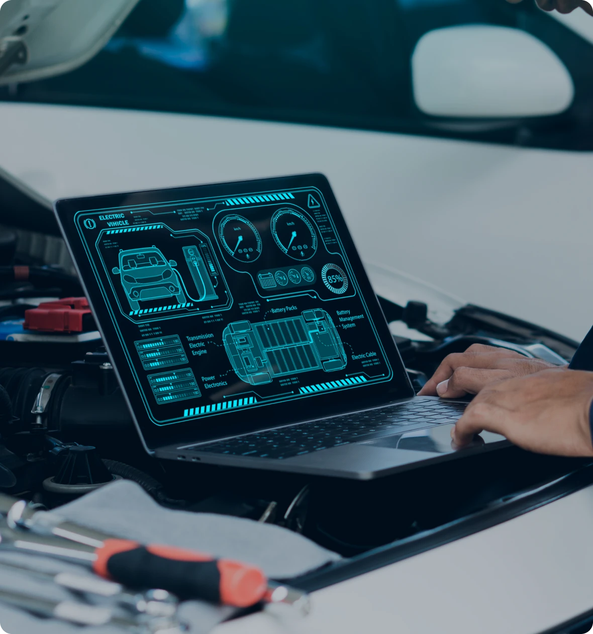 Technician analyzing car data on computer
